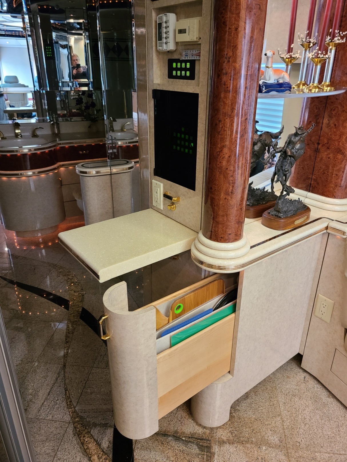 A shower with a gold shower head

Description automatically generated