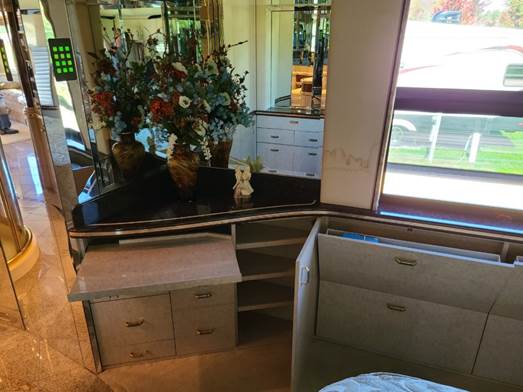 A black bus with a white ball on the side

Description automatically generated